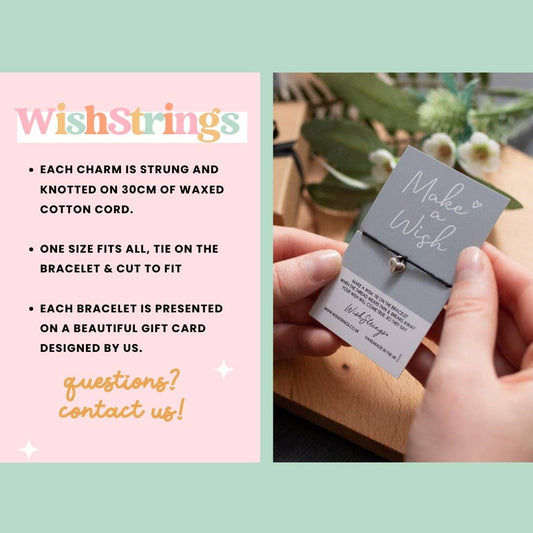 Bracelet with 'Make a Wish' charm held by a hand, displayed on a gift card with 'WishStrings' branding.