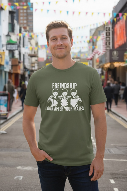 Man wearing a green t-shirt with a graphic and text on a street background