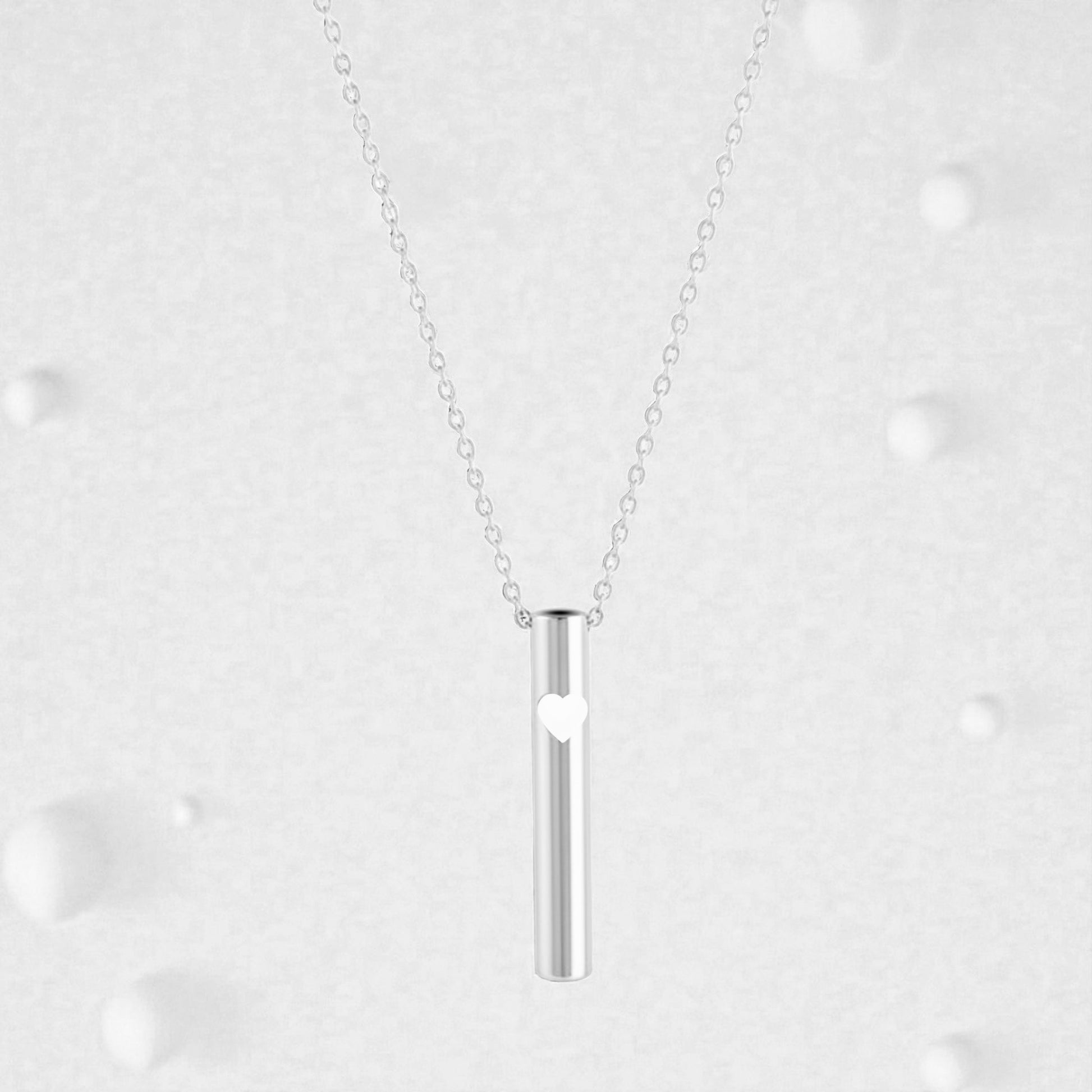 KALMii Anxiety Necklace set against a pale background. Silver pendant with white heart 