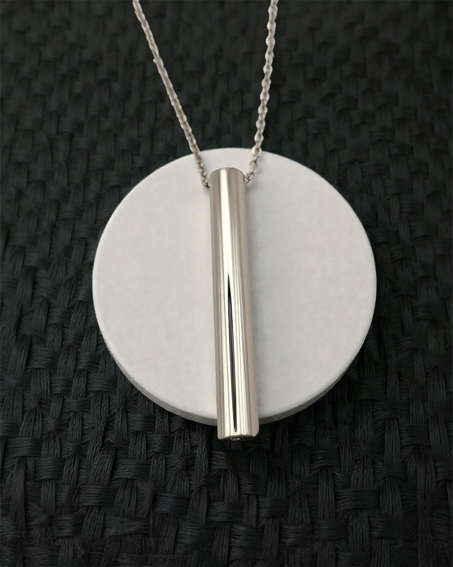 KALMii Anxiety Necklace in silver on white platform