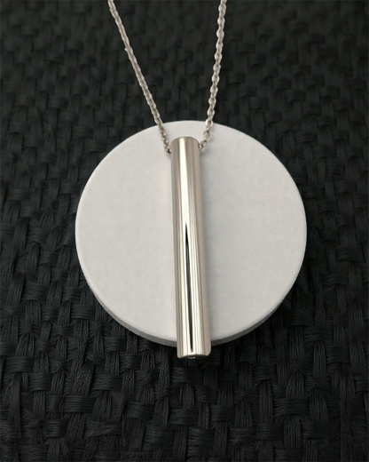 KALMii Anxiety Necklace in silver on white platform