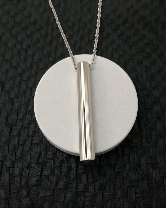 KALMii Anxiety Necklace in silver on white platform