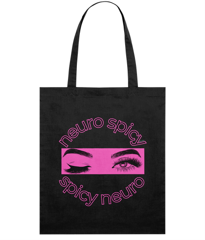 Black tote bag with pink 'neuro spicy' and 'spicy neuro' text and eye graphic on a white background