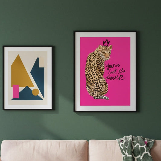 living room with green walls and leopard art print by KALMii