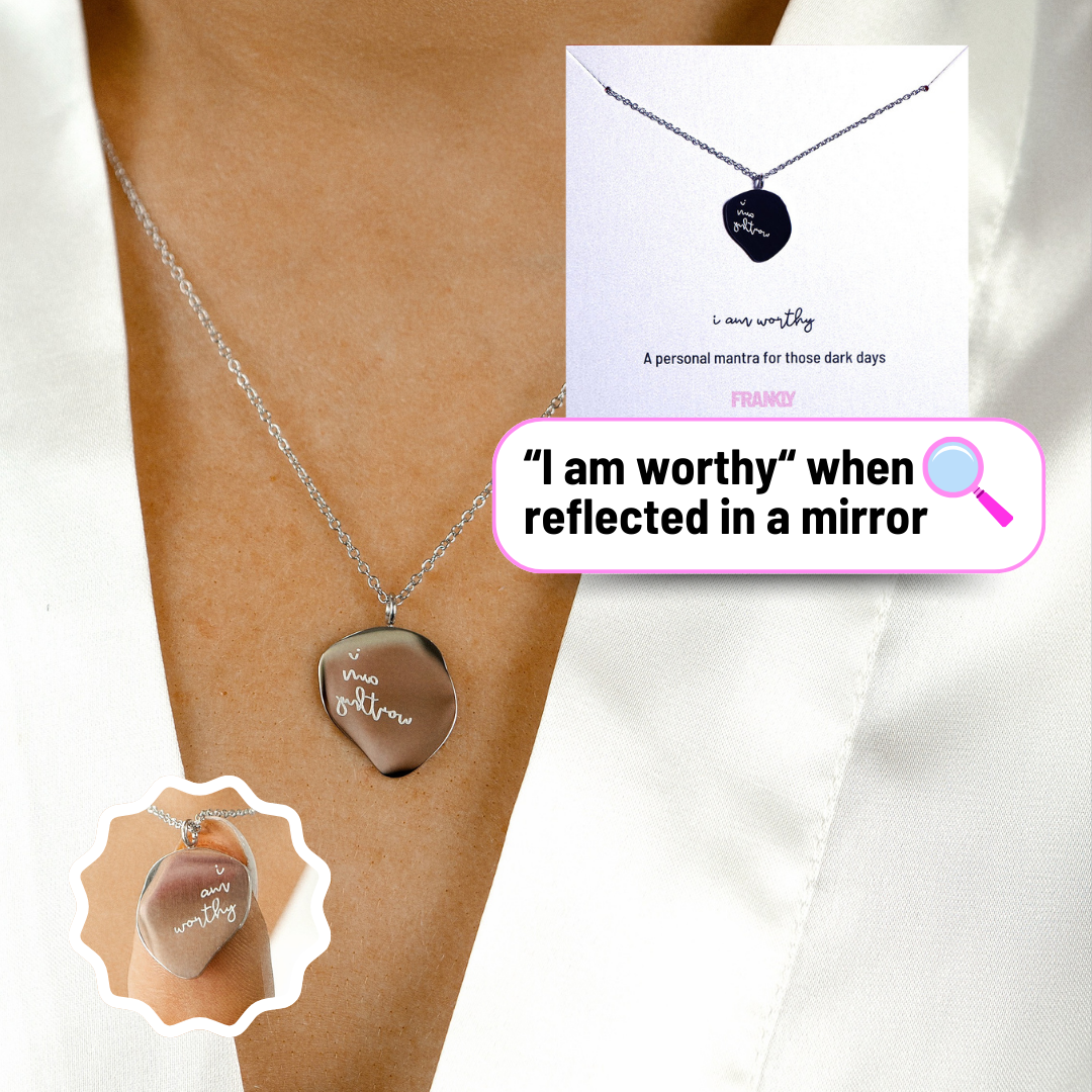 Necklace with motivational pendant on a person's neck, with packaging and text overlay.