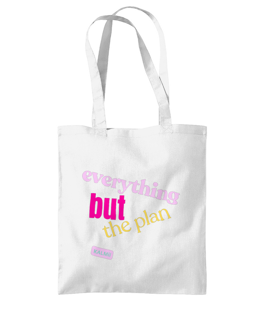 White tote bag with colorful text on a white background